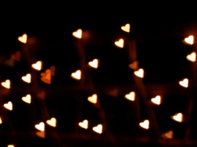 Black background with Hearts Bokeh Background Wallpaper