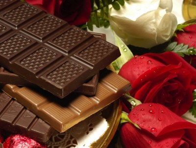 Chocolate with Red Rose Background Wallpaper